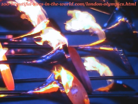 London Olympics 2012. Lighting the main torch from its 205 copper petals before launching it high