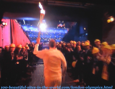 London Olympics 2012. An athlete taking London Olympics-torch to the stadium