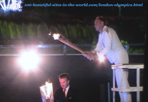 London Olympics 2012. Lighting the first torch from the torch that arrived by boat