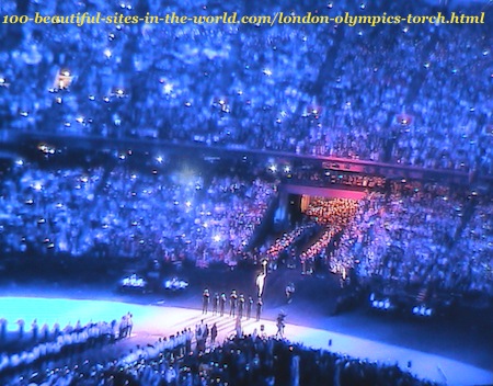 London Olympics 2012. An athlete taking London Olympics torch to the stadium